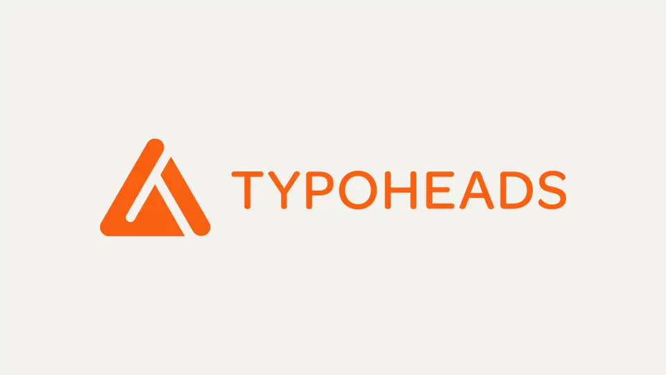 Oranges Dreieck als Bildzeichen, daneben TYPOHEADS